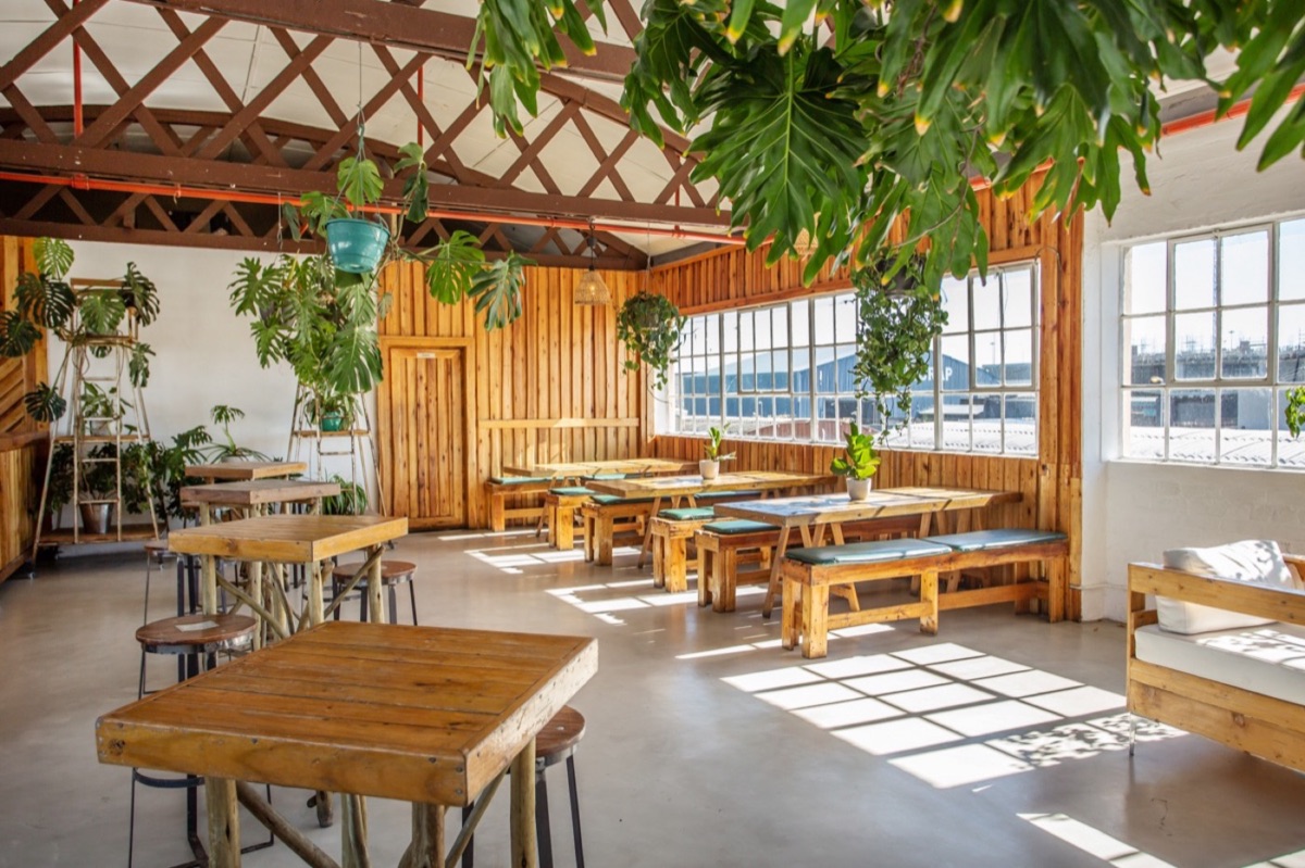 The main studio with steel windows and timber tables